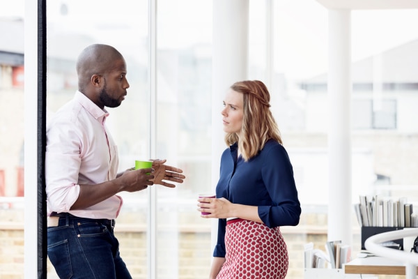 Man and woman having a discussion in an office