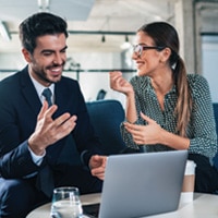 Man and woman coworker talking in the office