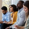 Businessmen and women sitting in a meeting