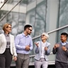 A group of coworkers walking and talking